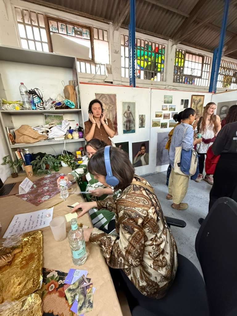 Open studio art event in Barcelona with visitors viewing classical oil paintings and contemporary artwork